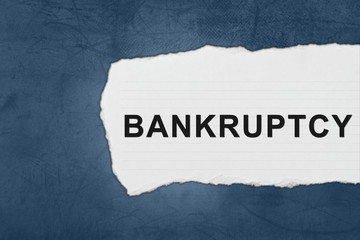 bankruptcy with white paper tears