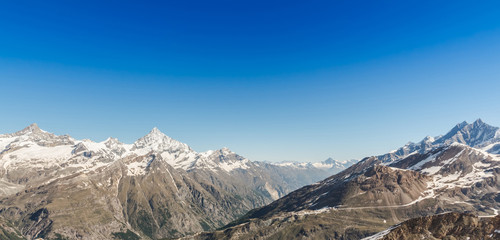 Fototapeta premium Mountain Range Landscape with Blue Sky at Alps Region, Zermatt,