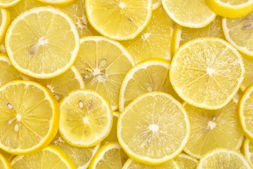 background of sliced ripe lemons
