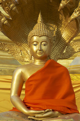 Buddha statue in red at Wat Boromthat, Tak, Thailand.