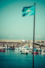 Flag of Spanish Asturias Autonomous community waving in the wind