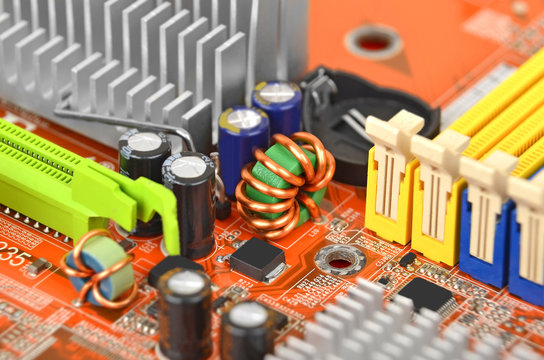 Printed computer motherboard with microcircuit, close up, DOF