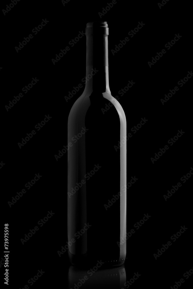 Wall mural elegant wine bottle in a black background