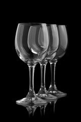 Three elegant wine glasses in a black background