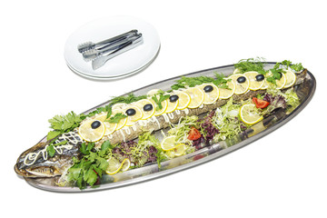 Served stuffed pike on metal plate, isolated, clipping path