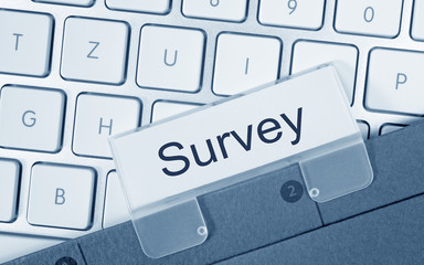 Survey folder on computer keyboard