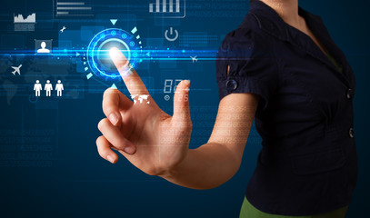 Young business woman touching future web technology buttons and