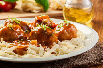Pasta fettuccine and meatballs with tomato sauce