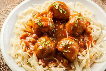 Pasta fettuccine and meatballs with tomato sauce