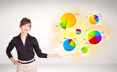 Fototapeta premium Business woman with colorful graphs and charts