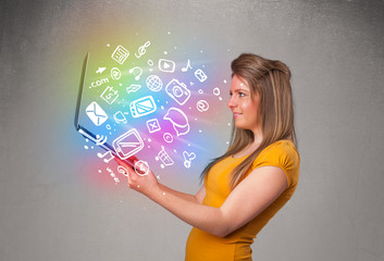 Young lady holding notebook with colorful hand drawn multimedia