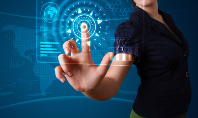 Woman pressing high tech type of modern buttons