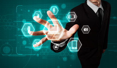 Businessman pressing virtual media type of buttons