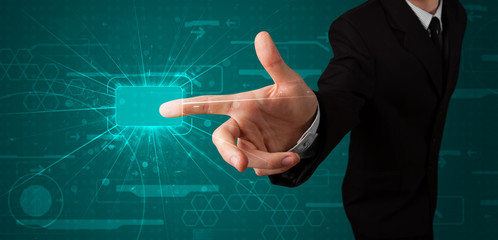 Businessman pressing high tech type of modern buttons