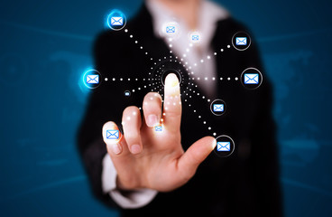 Woman pressing virtual messaging type of icons