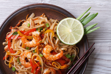 Asian rice noodles with shrimp and vegetables top view © FomaA