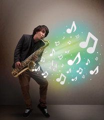 Young musician playing on saxophone while musical notes explodin
