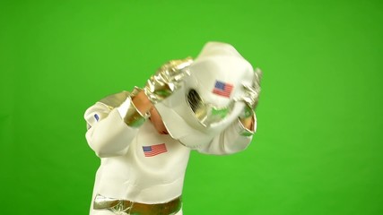 astronaut takes off his helmet and suffocate - green screen