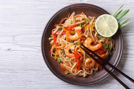 Rice noodles with shrimps and vegetables top view