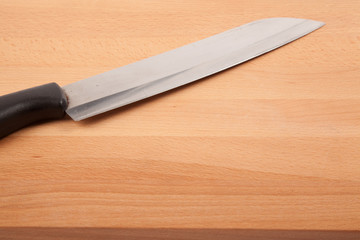 Knife and  wooden chopping board