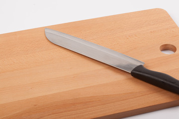 Knife and wooden chopping board