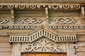 Traditional wooden Russian carved platband of an old house