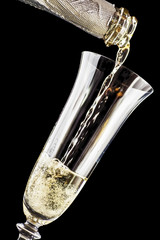 Champagne is poured into wine glass