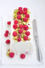 Healthy yogurt ice cream with raspberries and pistachios