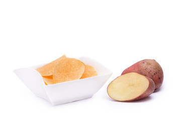 Potato chips in bowl isolated on white