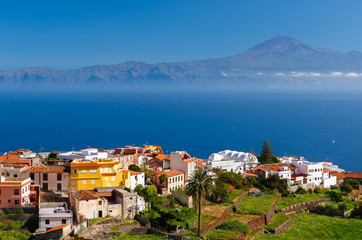 View of Agulo town and Teide volcano in distance, La Gomera