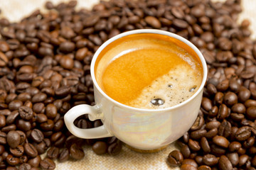 cup of coffee on linen cloth
