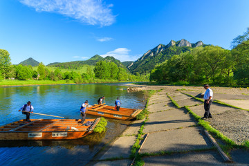 Tourists raft on the Dunajec river in Pieniny Mountains, Poland