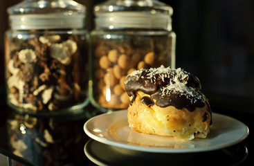 Eclairs with cream in chocolate coating