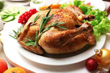 Baked chicken for festive dinner. Christmas table setting