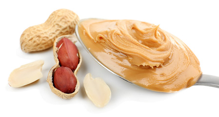 Creamy peanut butter in spoon, isolated on white