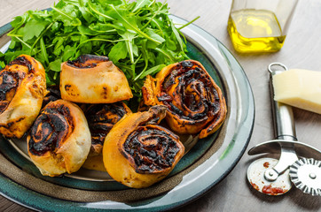 Pizza snails, minipizza with salad and parmagio