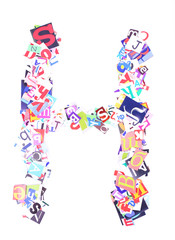 Letter H made of colorful newspaper letters isolated on white