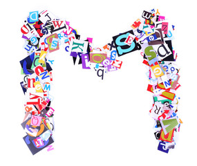 Letter M made of colorful newspaper letters isolated on white