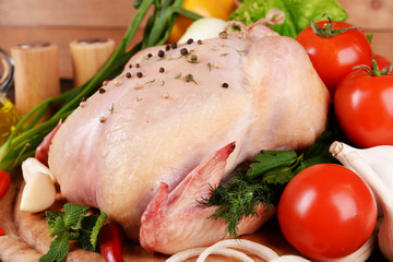 Raw chicken on wooden table