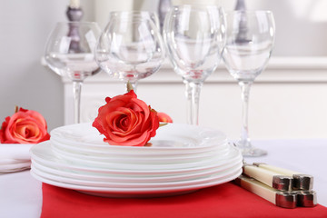 Festive table setting on room background