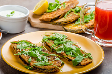 Breaded eggplant parmesan and arugula