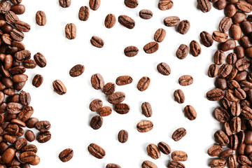 Coffee beans on white table, close-up