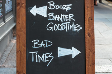 Chalk board with good times versus bad times - 73994933