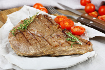 Delicious grilled meat on table