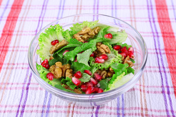 Fresh salad with greens, garnet and spices