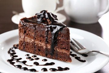 Yummy chocolate cake served on table, close-up