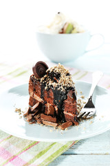 Yummy chocolate cake served on table