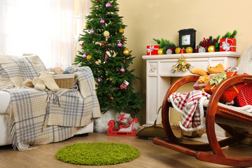 Beautiful Christmas interior with decorative fireplace and fir