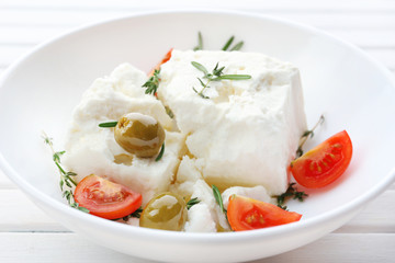 Feta cheese on wooden table