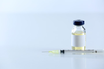Vaccine in vial with syringe